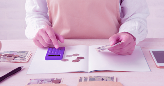 man totaling household budget