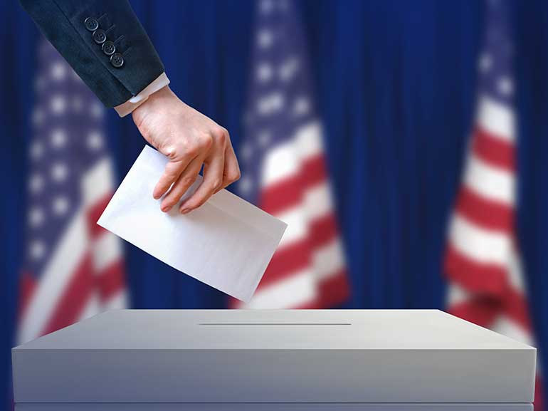 An image of a person voting in the USA