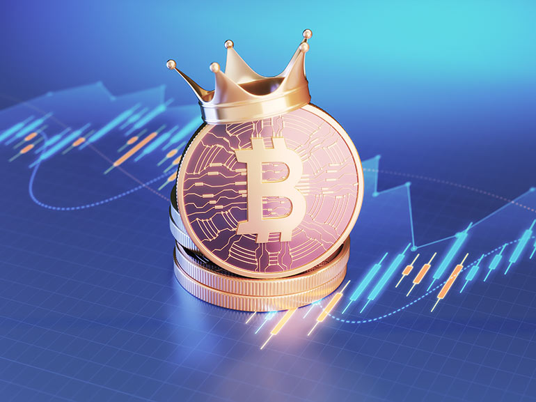 Bitcoin coins with a crown on top of financial charts