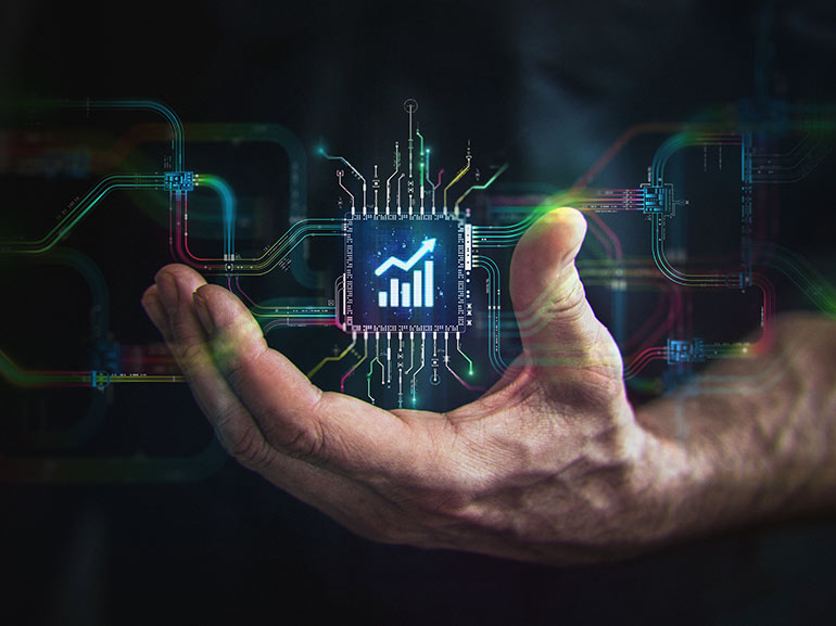 Man holding a computer chip with growing chart in the center