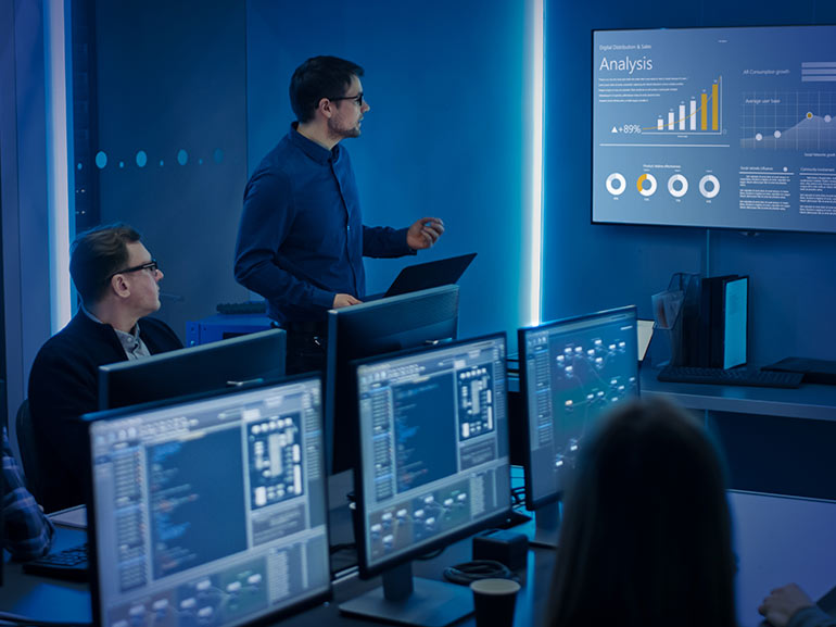 An image of traders analysing trading charts