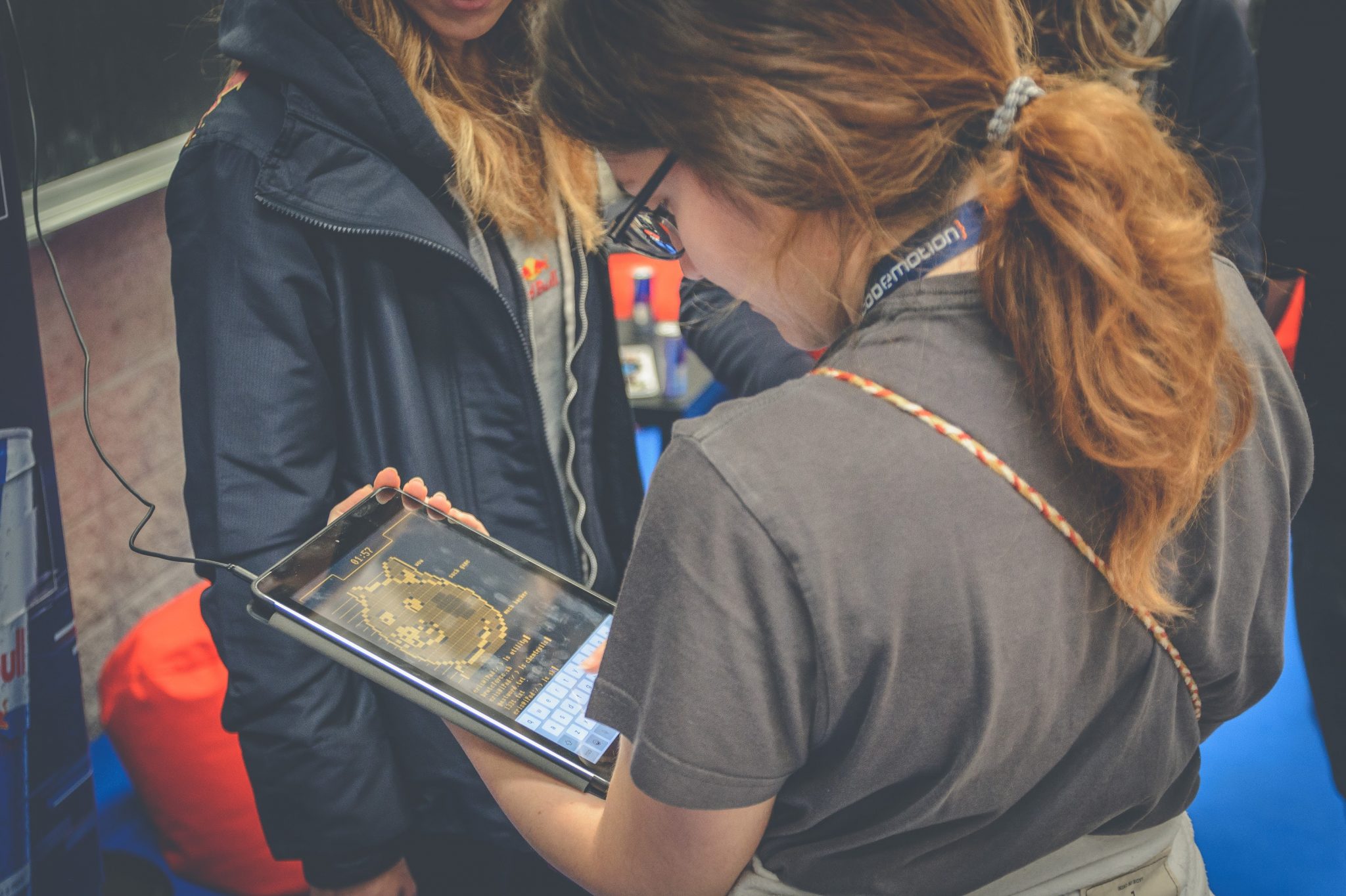 Girl playing with an iPad the Red Bull hacking experience