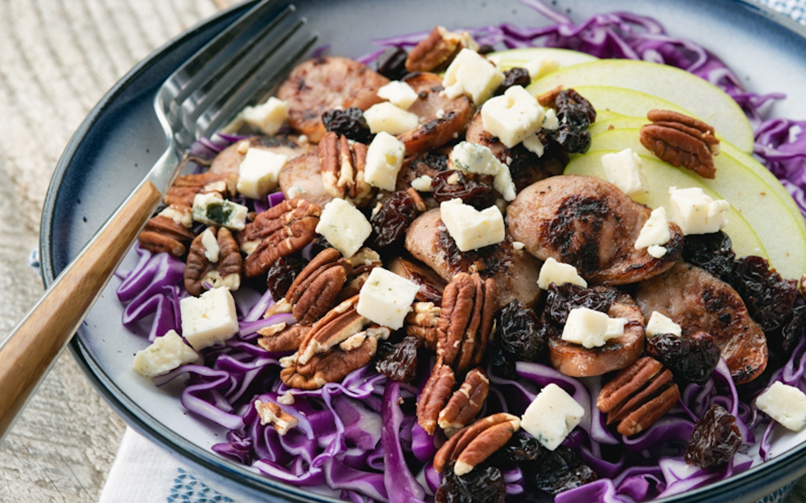 Red cabbage, sausage and apple salad with gorgonzola