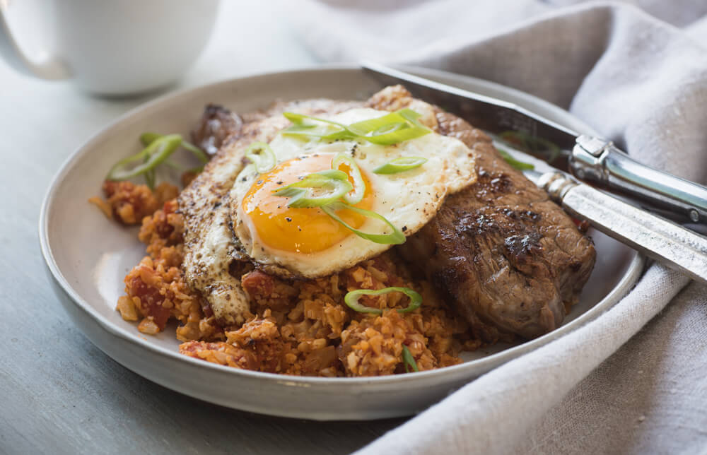 Steak and eggs with tomato cauliflower rice