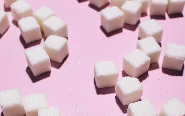sugar cubes on a pink background