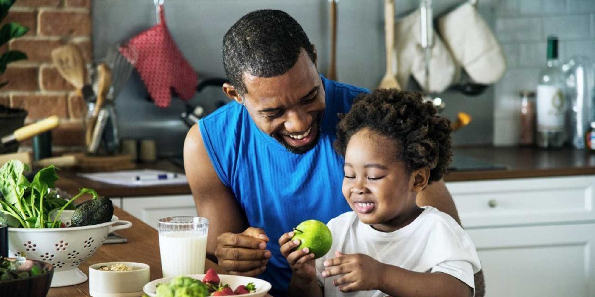 father-and-son-preparing-healthy-meal-in-the-kitchen