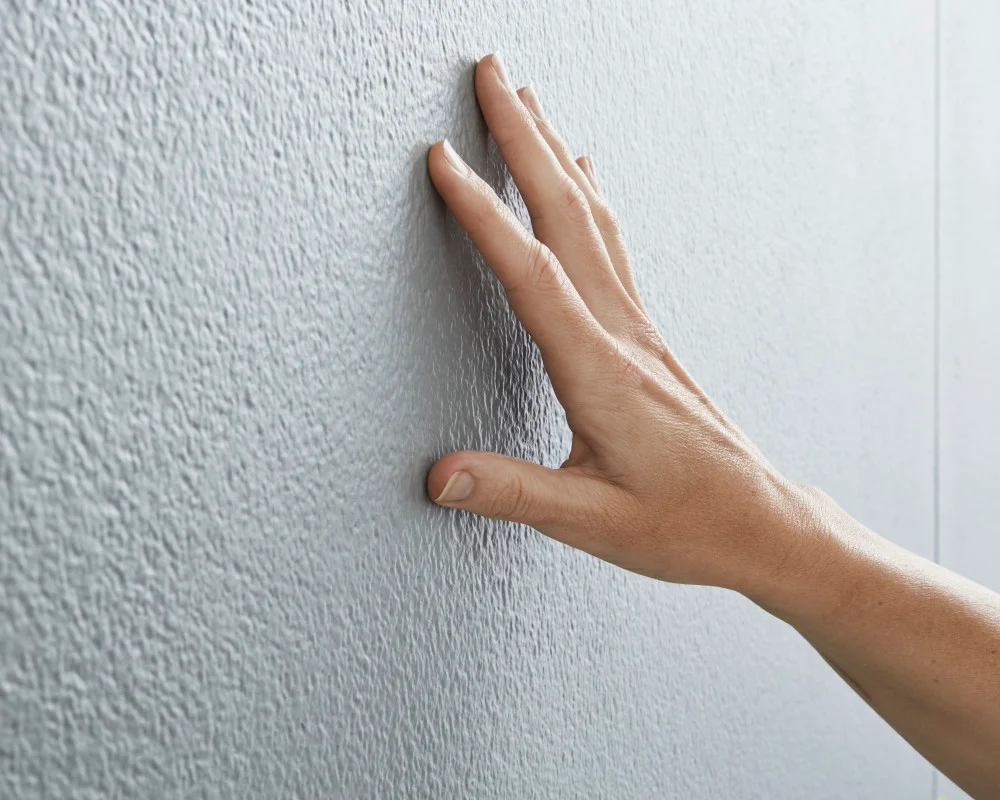 hardie-fine-texture-grey-texture-close-up hand-james-hardie