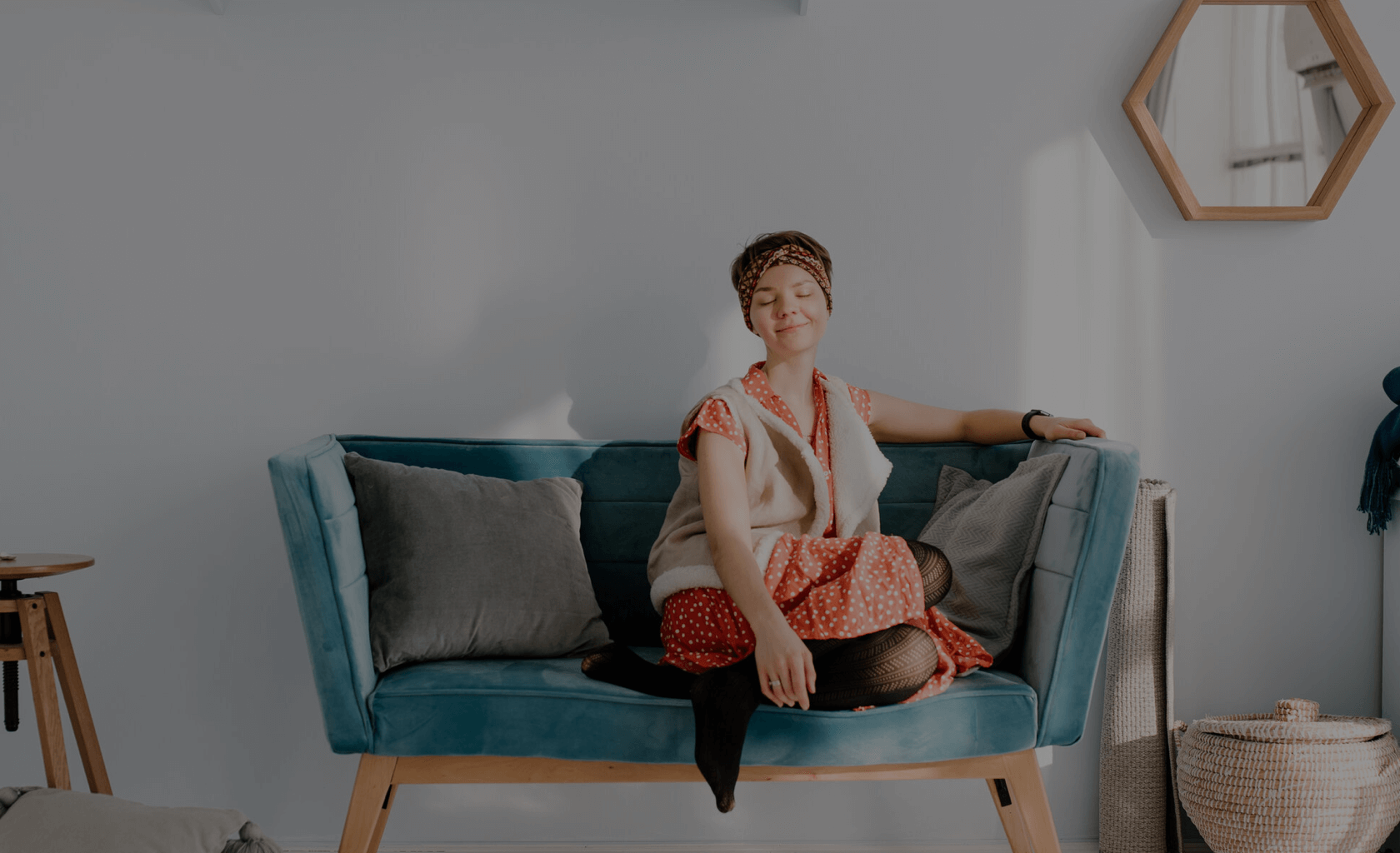 a content woman sitting on a sofa