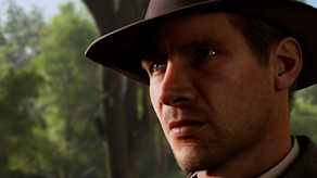 Indy makes a serious face against a backdrop of trees