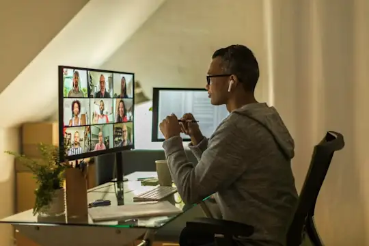 Man working from home on a Zoom call.