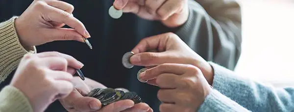 debt_consolidation_--_multiple_hands_removing_money_from_one_hand.jpg