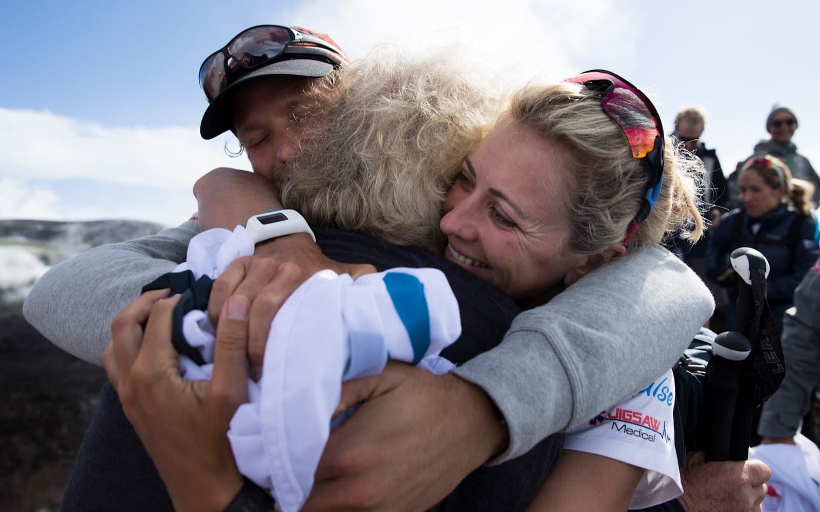 Richard Branson hugging family after a hike