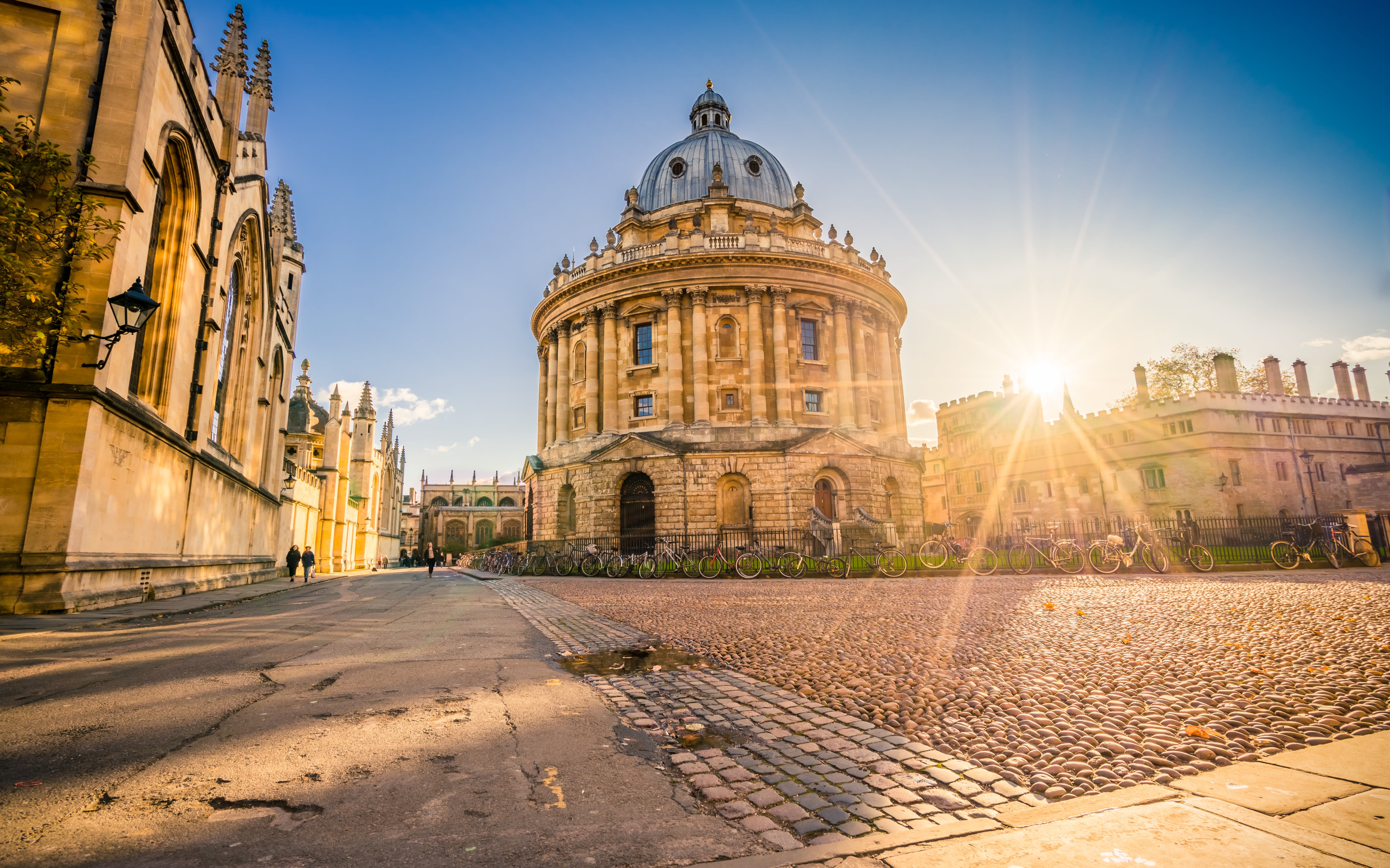 Radcliffe square with Science Library and sunset flare in Oxford, England.