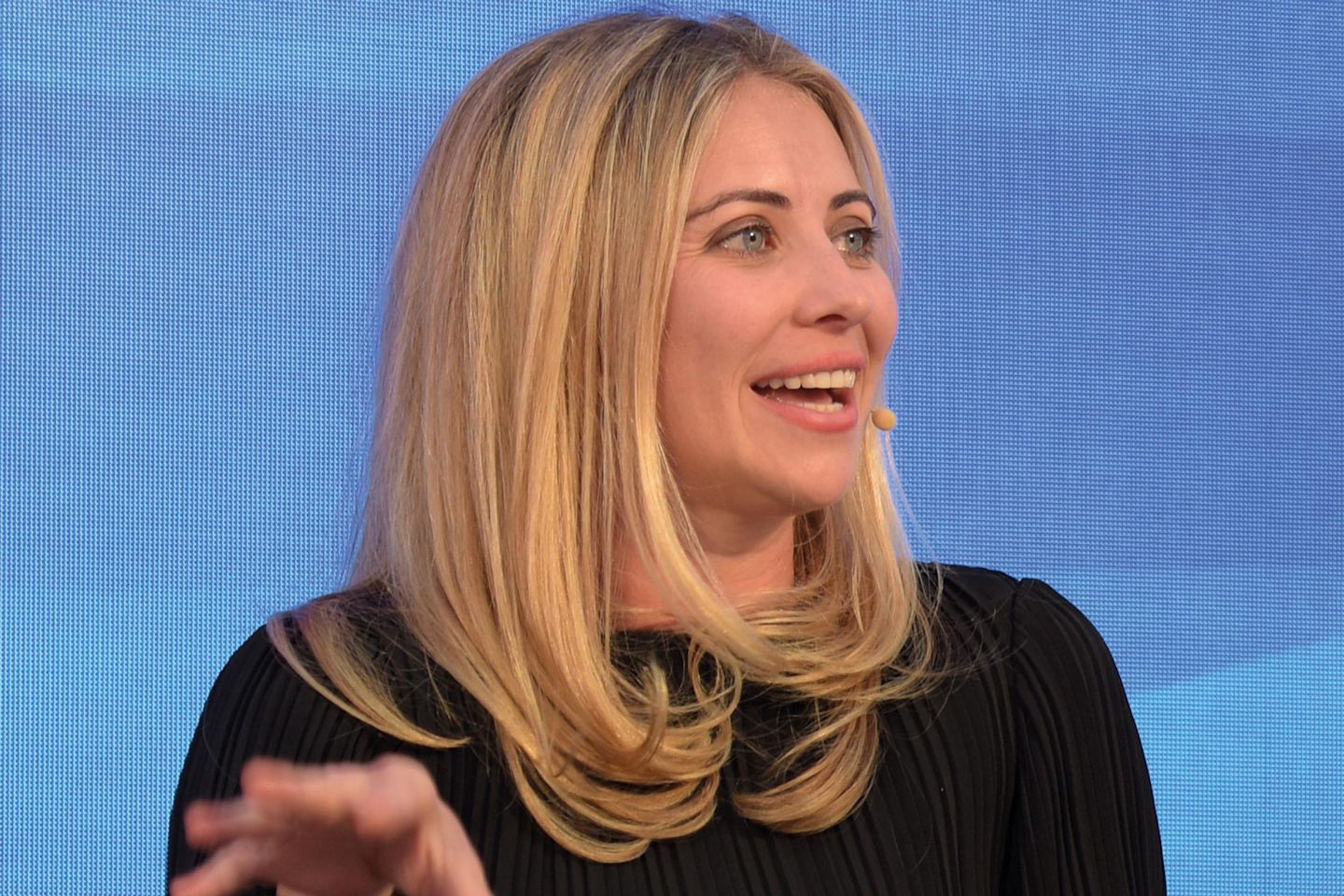 Holly Branson speaking on stage at the 2019 Fast Track 100 event in Oxford