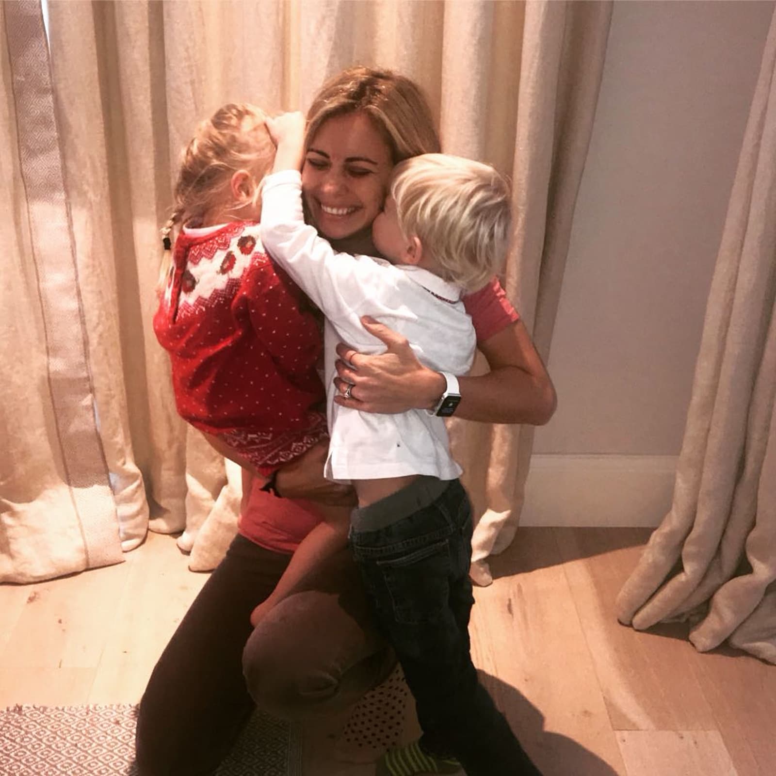 Holly Branson hugging her children Etta and Artie