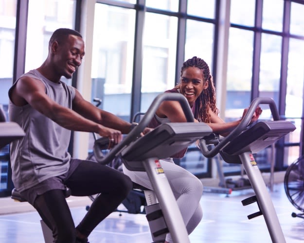 Two people on exercise bikes at Virgin Active South Africa