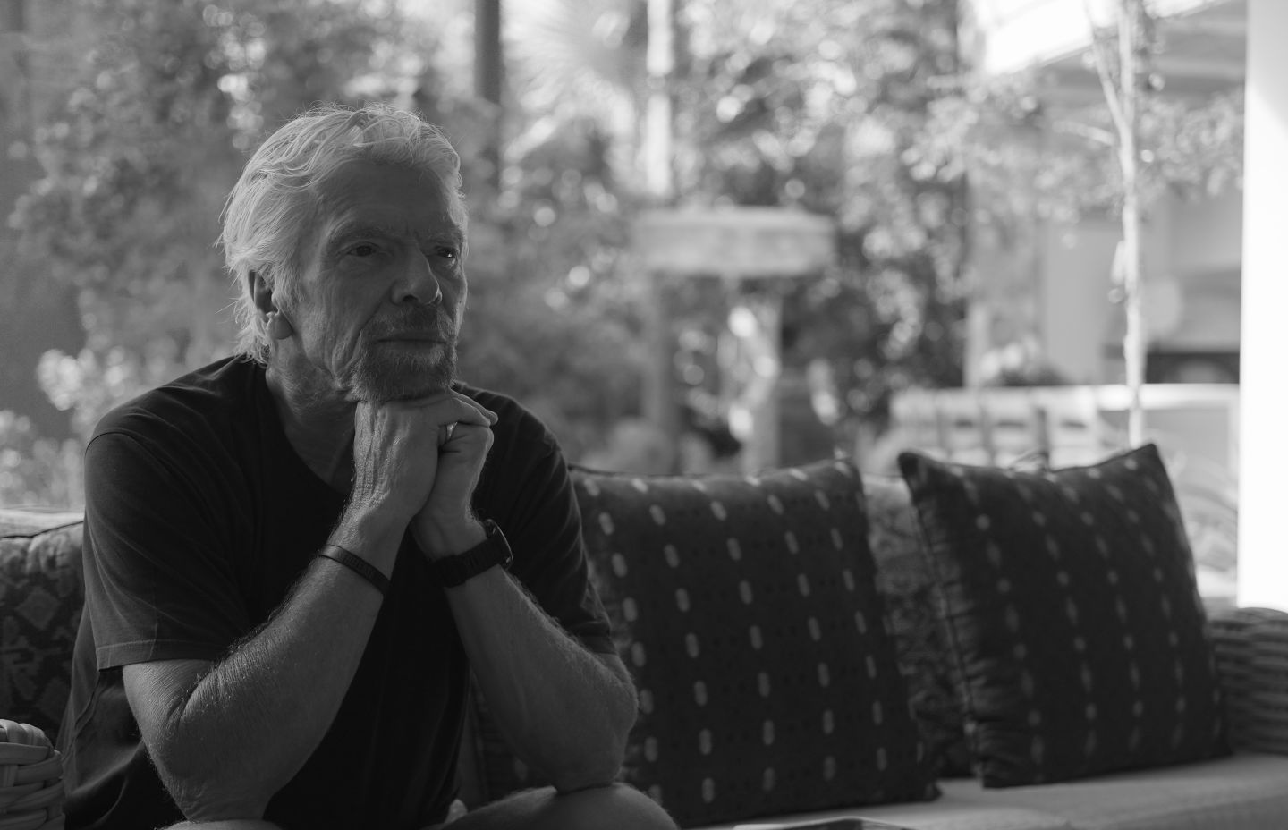 Richard Branson sitting at his home on Necker Island