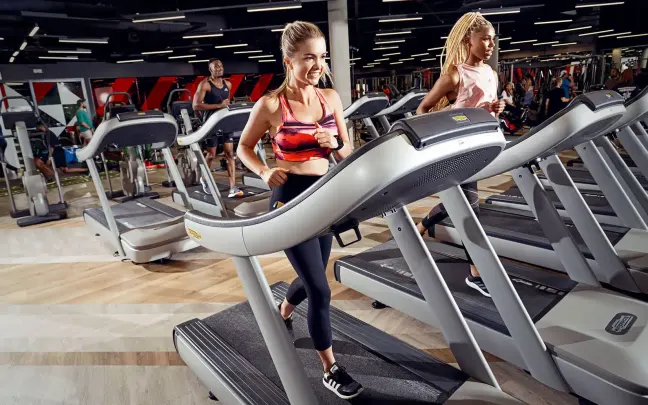 Two women on treadmills at Virgin Active