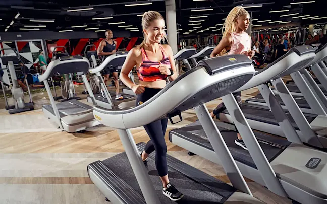 Two women on treadmills at Virgin Active Two women on treadmills at Virgin Active
