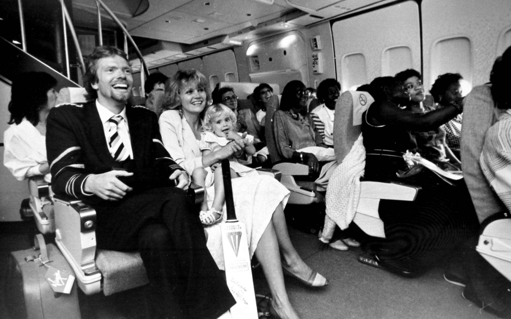 Richard and family sitting on their seats on Virgin Atlantic's inaugural flight 