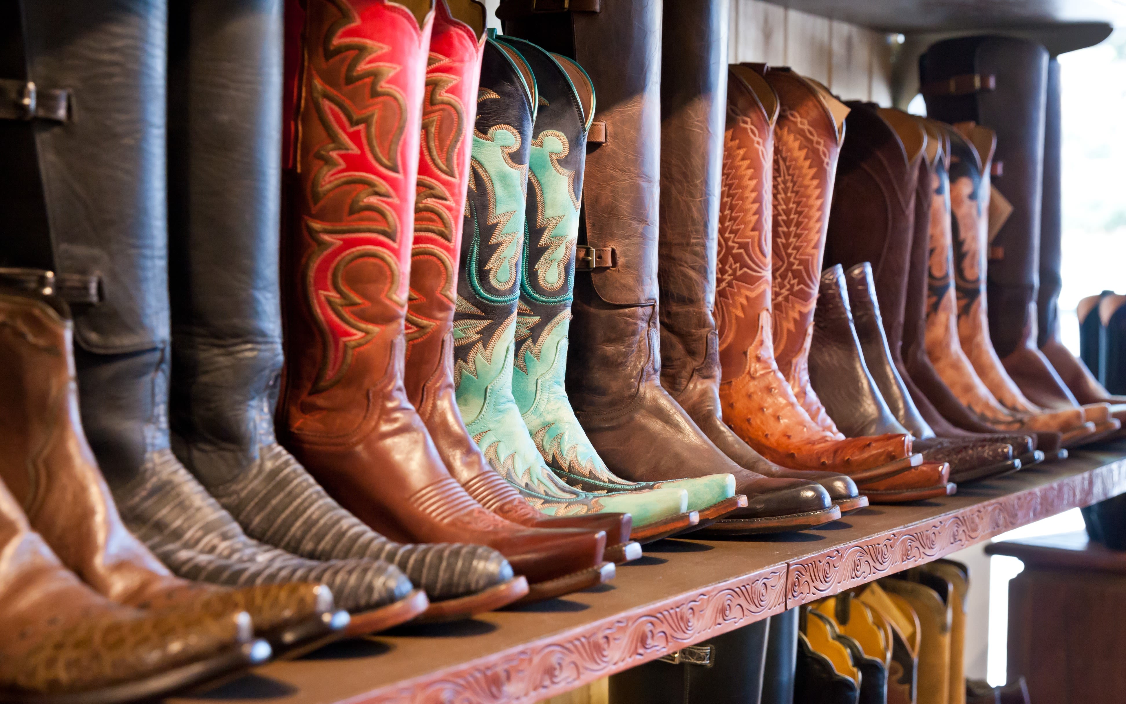 An image of cowboy boots on a shelf