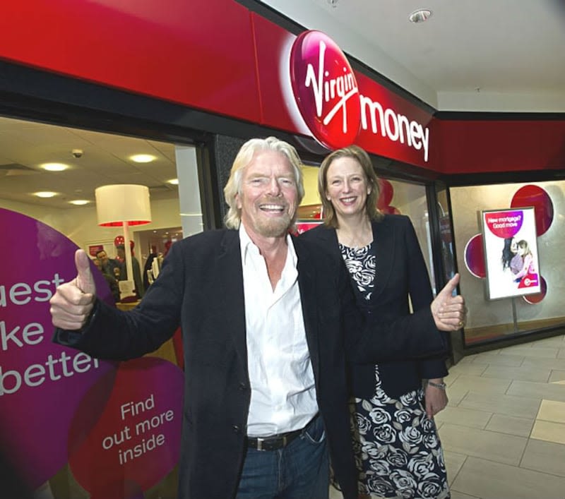 Richard Branson and Jayne-Anne Gadhia outside a Virgin Money branch