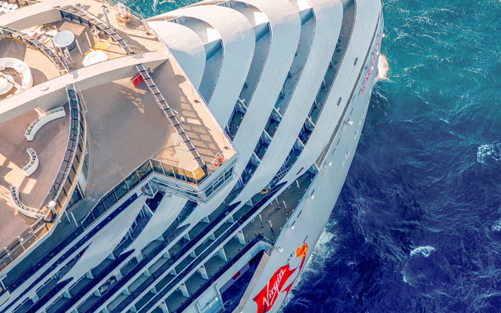 Picture looking down at the front of Virgin Voyages' ship Scarlet Lady