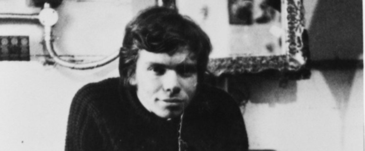 Black and white image of a young Richard Branson in his office