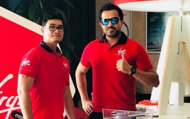 Habib Ghazi with a colleague at Virgin mobile UAE