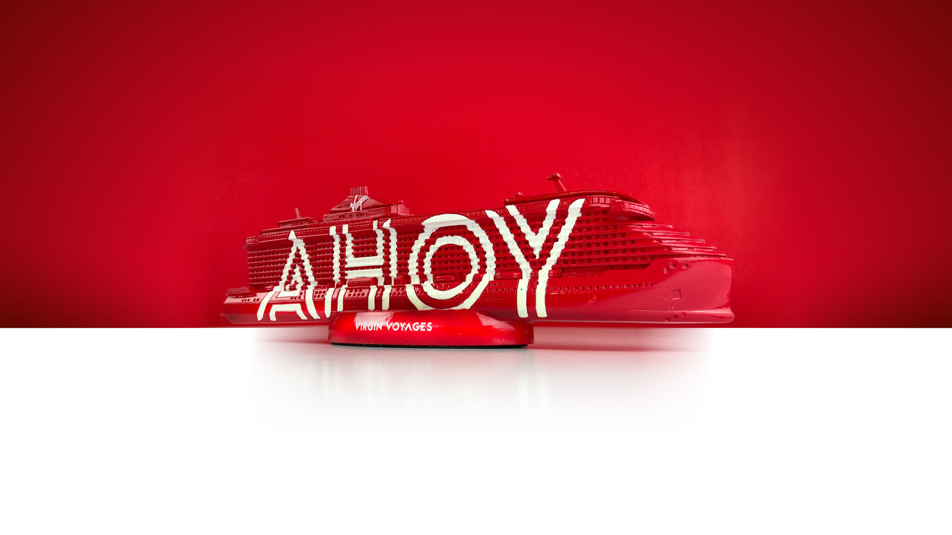 Virgin Voyages ship model with AHOY written on the side