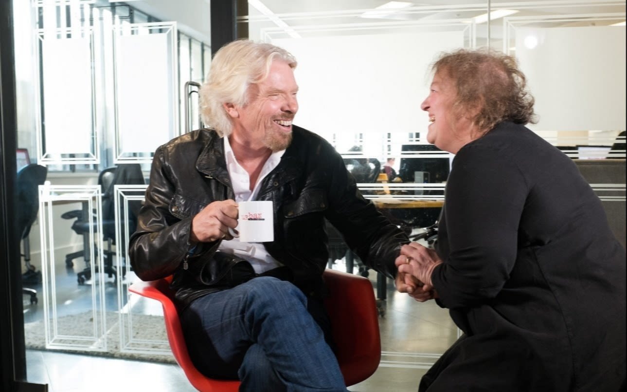 Richard Branson laughs with Christine Taylor, founder of Choccywoccydoodah