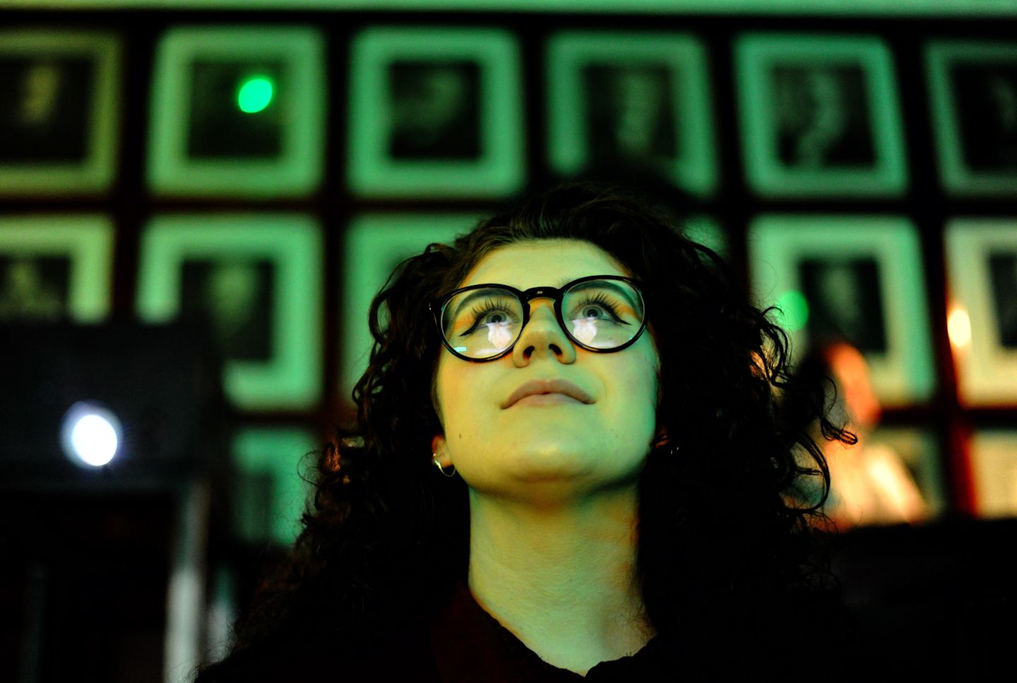 Virgin Money Foundation young change maker looking upwards with a green background