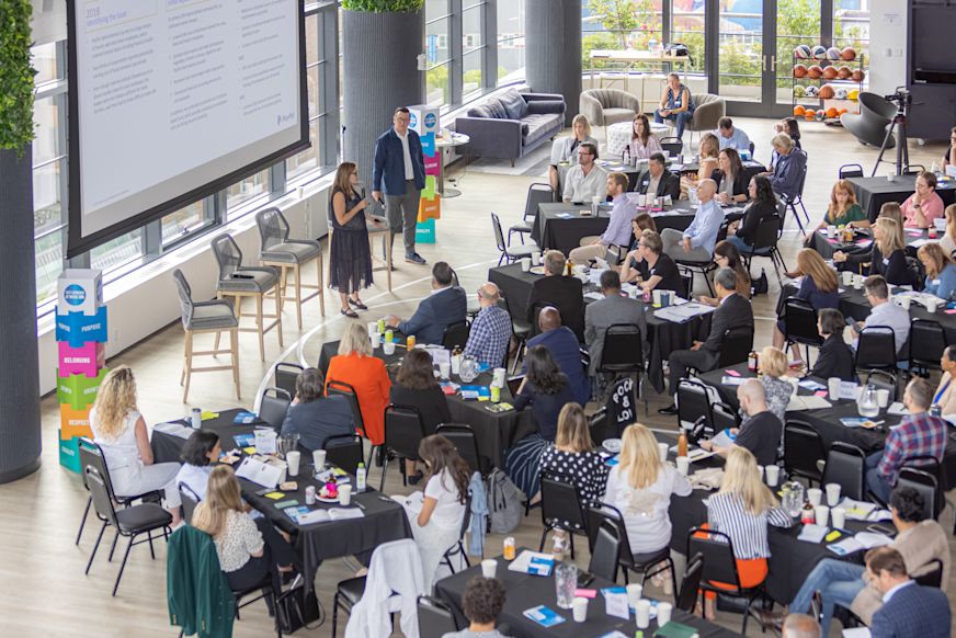 Alison Omens, President at JUST Capital and Tyler Spalding, Senior Director of Corporate Affairs & Global Head of Social Innovation at PayPal present at a 100% Human at Work gathering in New York | 100% Human at Work | 100% Human at Work
