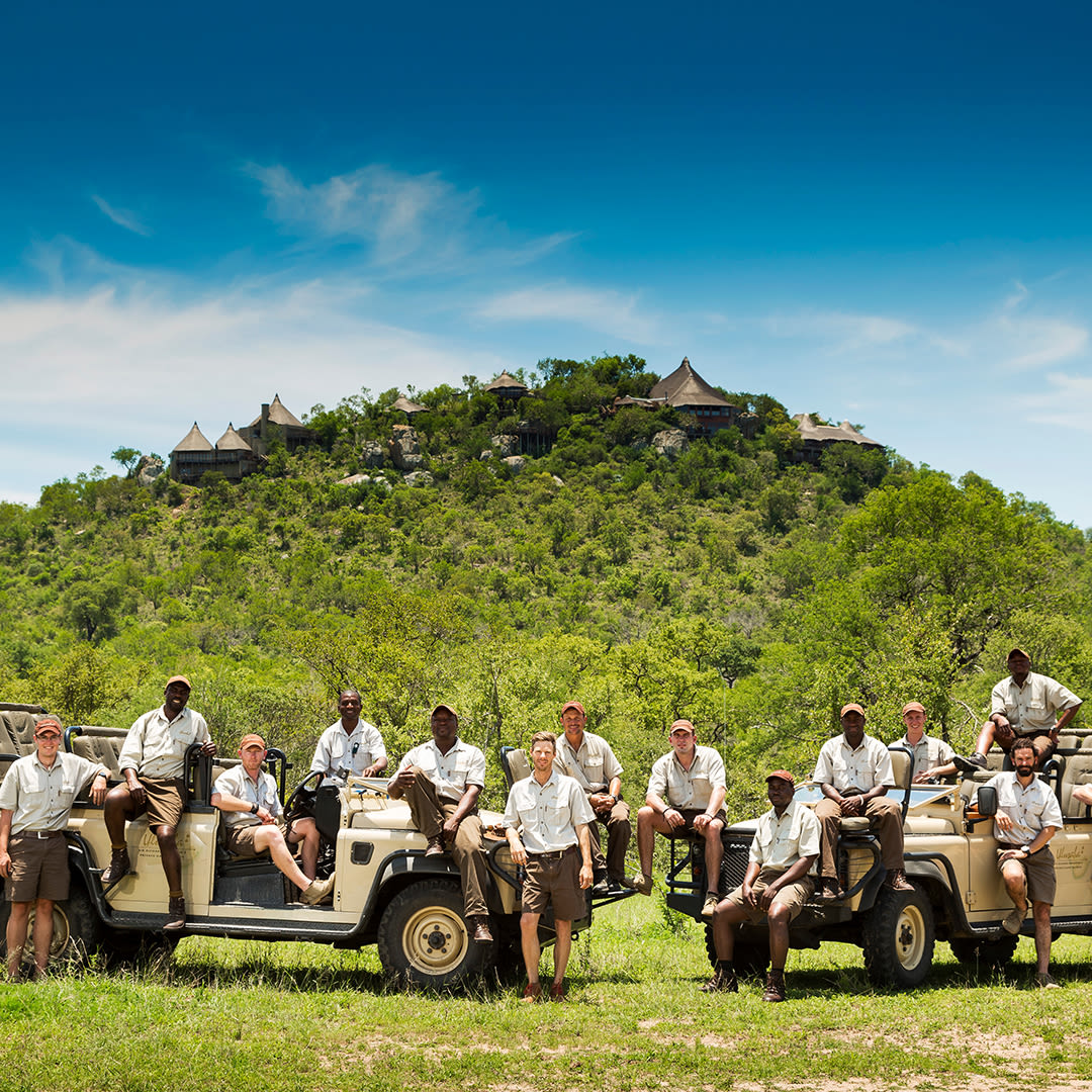 A group of rangers standing in front of Ulusaba Rock Lodge