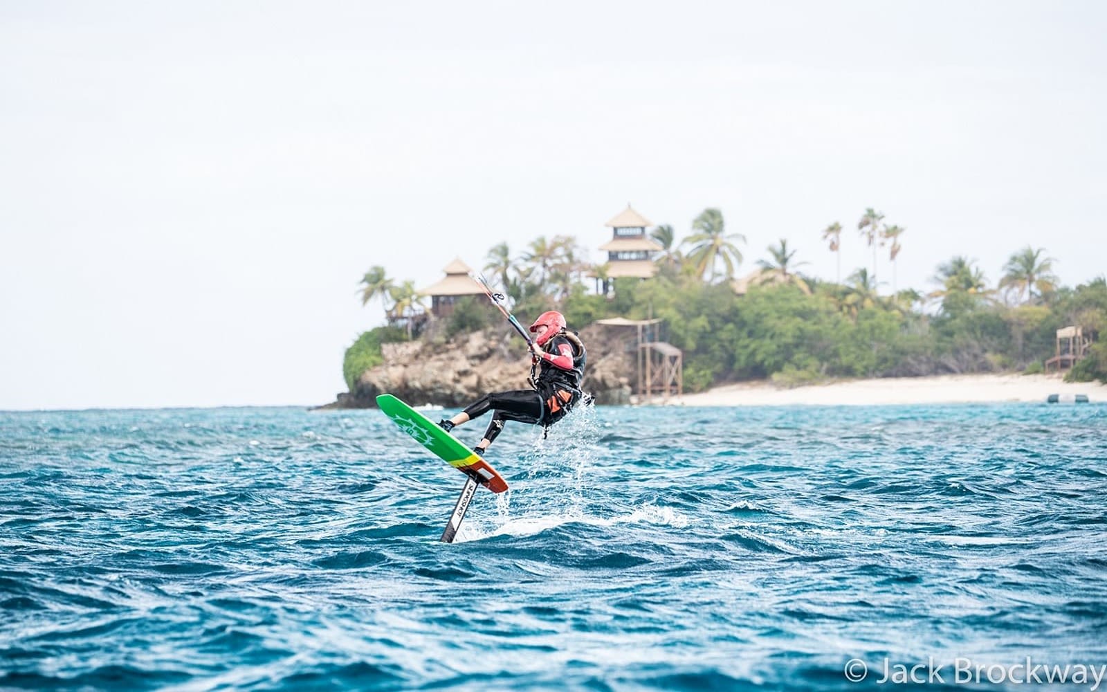 picture of someone on a green yellow and red foil board at Necker 