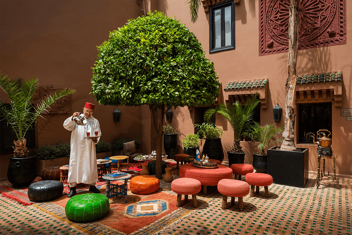 A man pours tea outside at Kasbah Tamadot