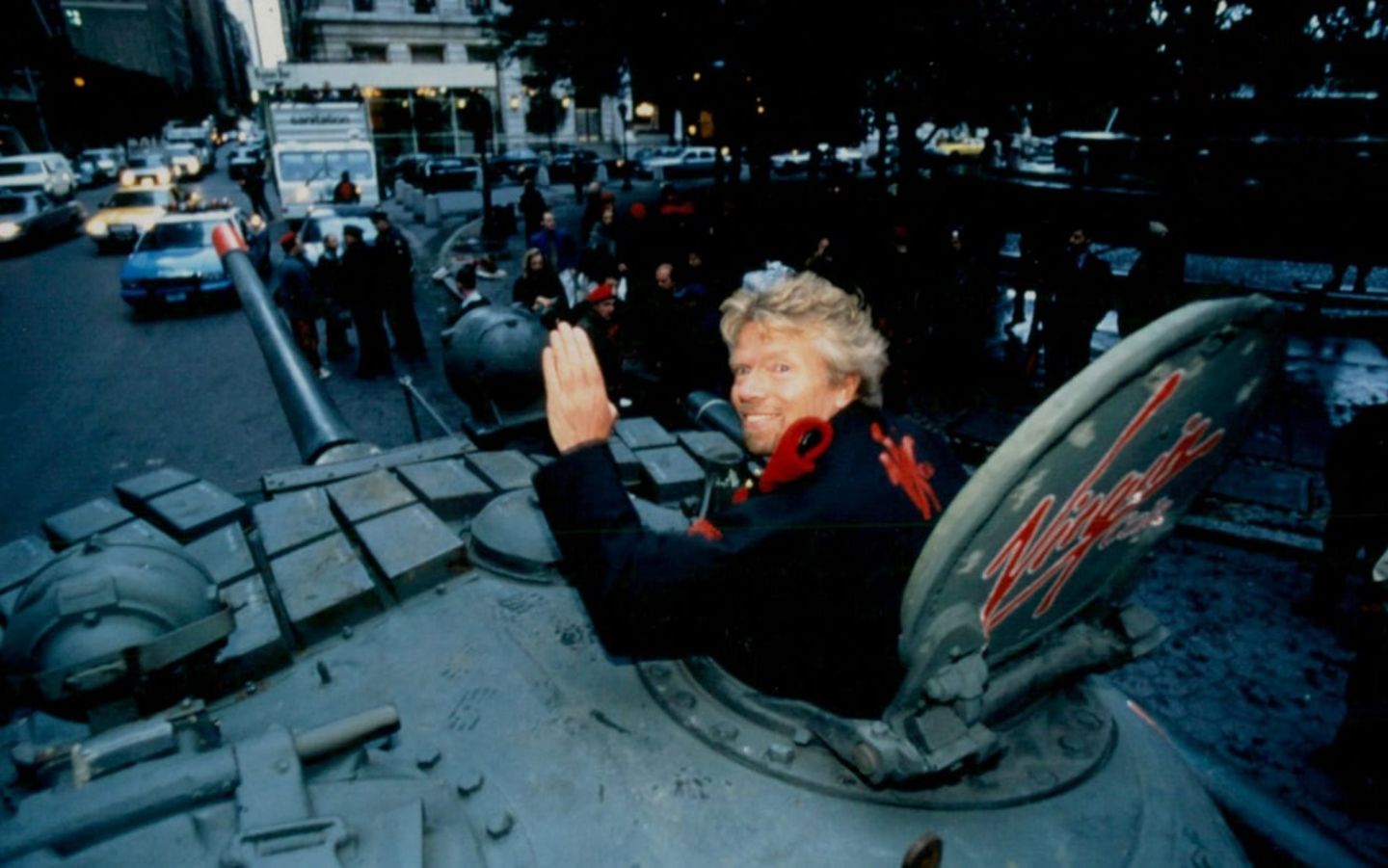 Richard Branson in a tank waving