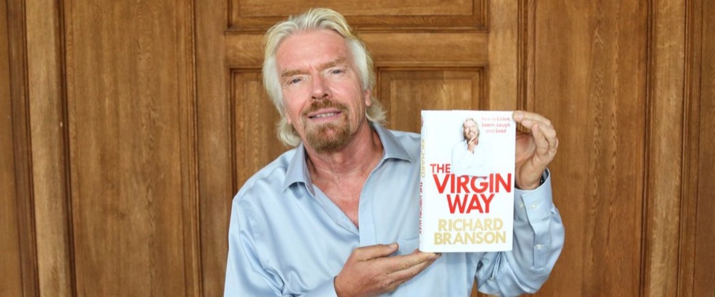 Richard Branson posing with his book 'The Virgin Way'