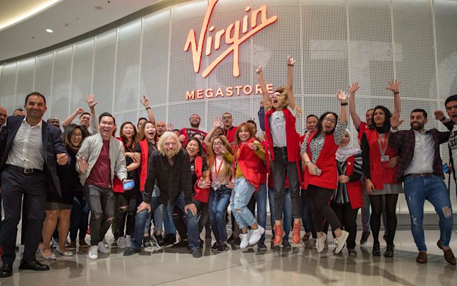 Richard Branson with Virgin Megastore employees Richard Branson with Virgin Megastore employees