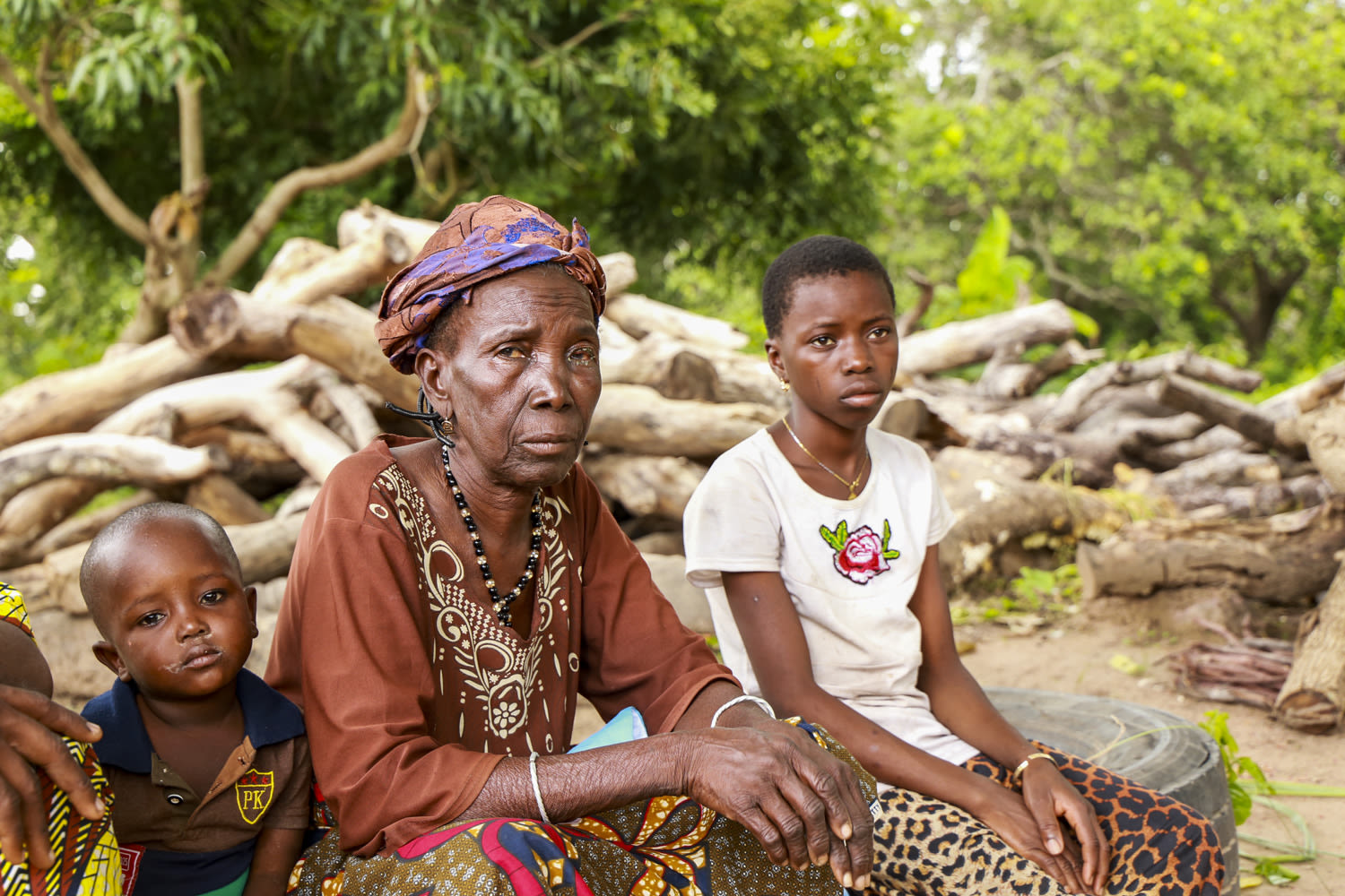 Safira (middle) sits with her family in Borgou Department, Benin. Following her trachoma surgery, she said "What they have done for me is immeasurable."