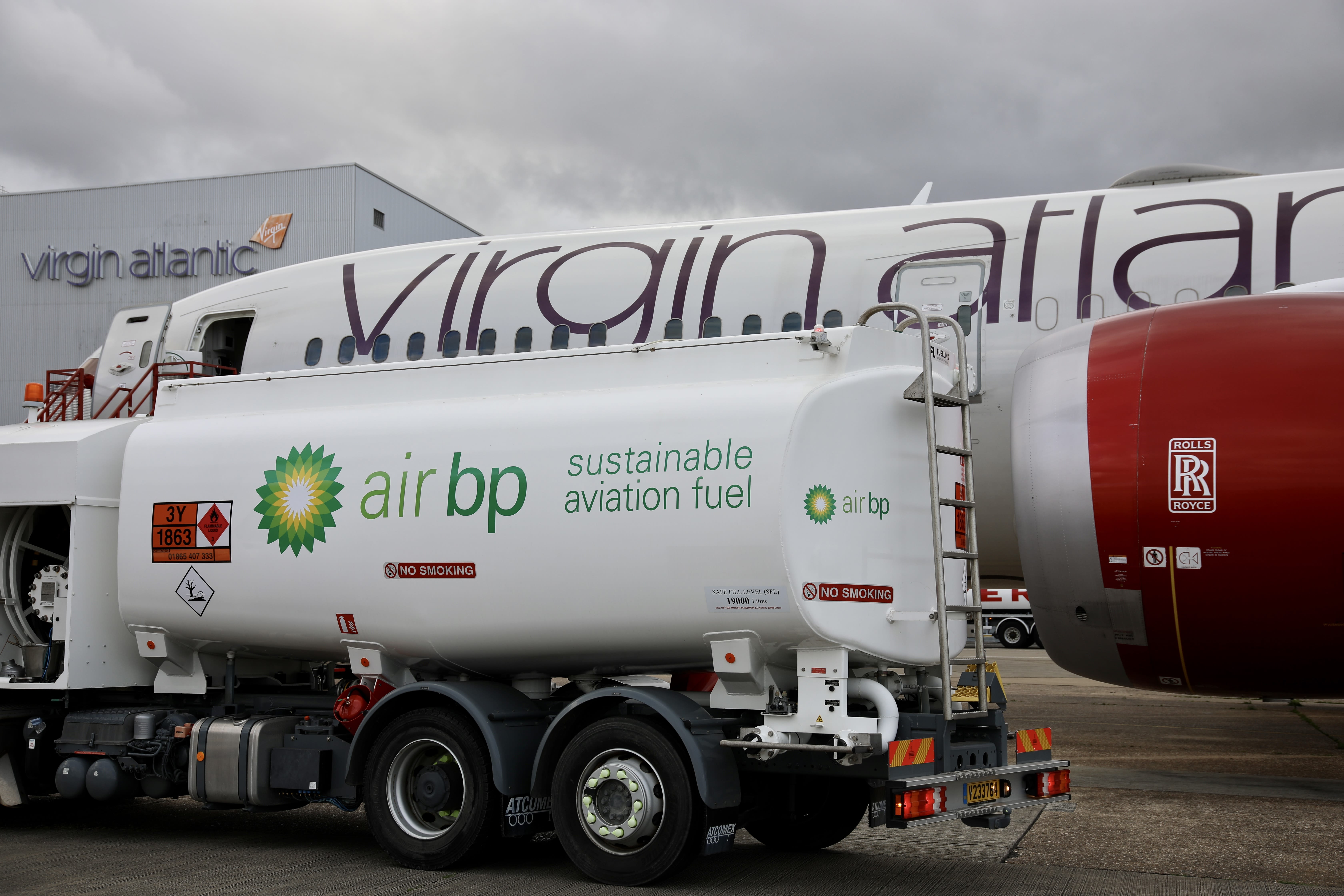 An Air BP Sustainable Aviation Fuel tanker next to a Virgin Atlantic Boeing 787 aircraft