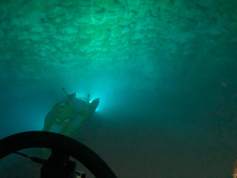 Submarine underwater with headlights in the Belize Blue Hole
