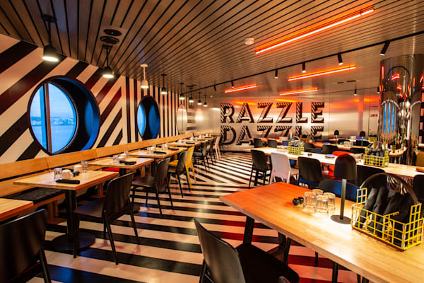 The Razzle Dazzle restaurant on-board Virgin Voyages Scarlet Lady ship