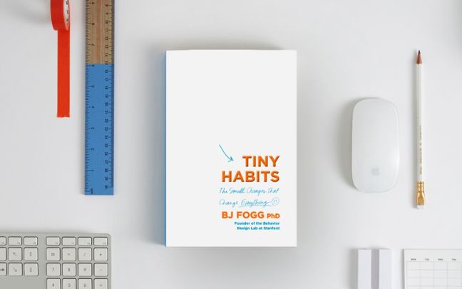 A copy of Tiny Habits surrounded by stationery