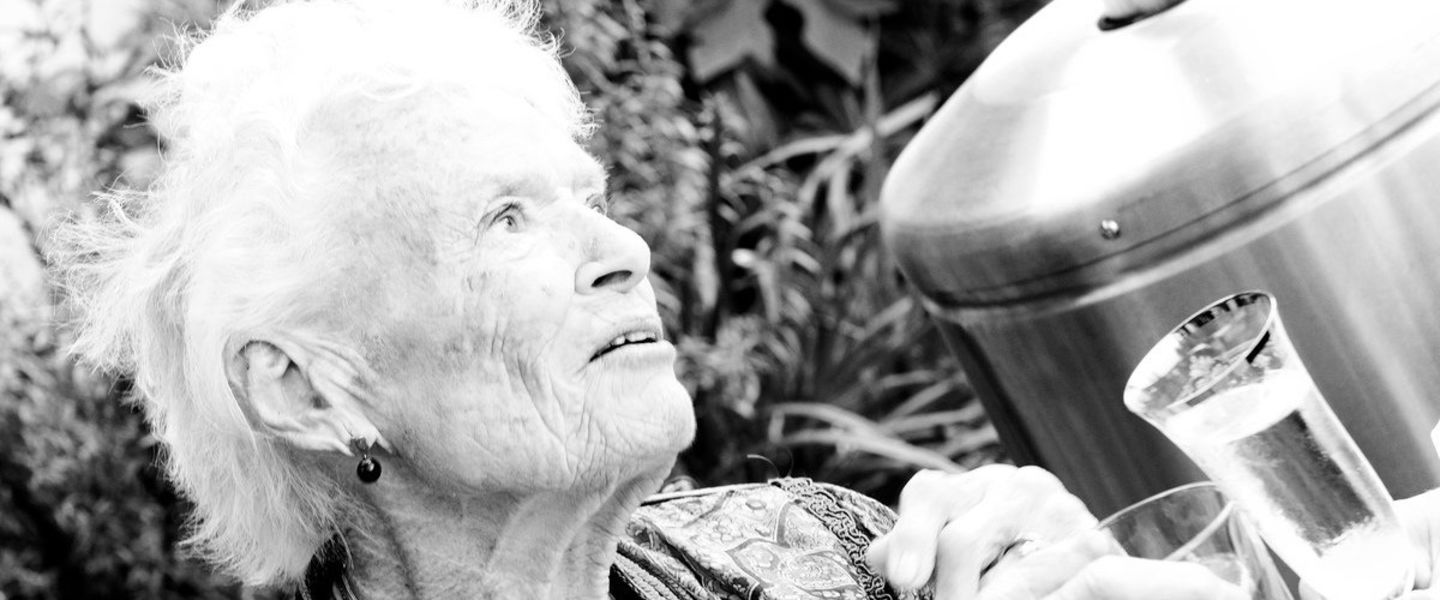 A black and white photo of Eve Branson on a rooftop garden