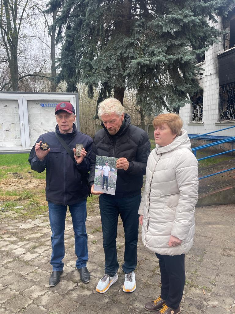 Richard Branson with a family in Ukraine