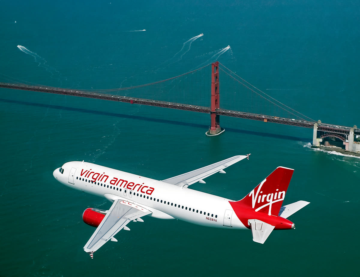 Virgin America plane flying over the Golden Gate Bridge