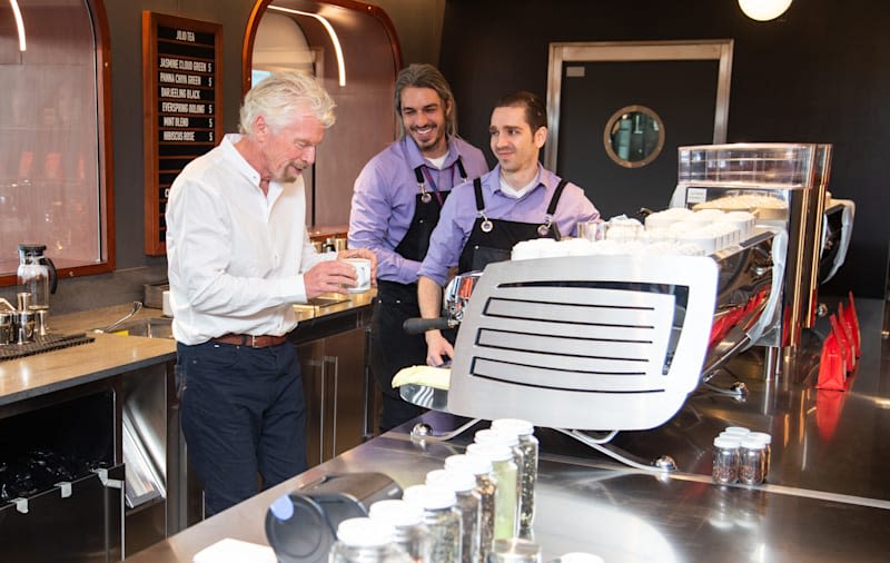 Richard Branson having a cup of tea with the Virgin Voyages crew