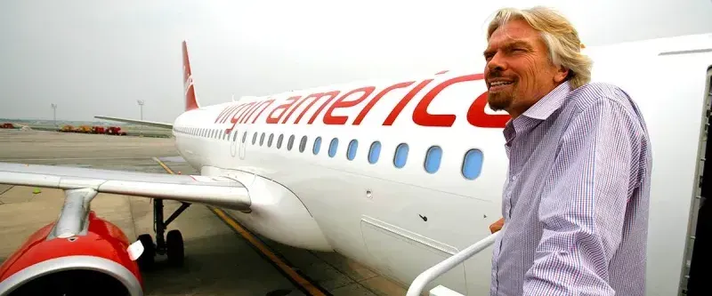 Richard Branson boards a Virgin America plane in 2016