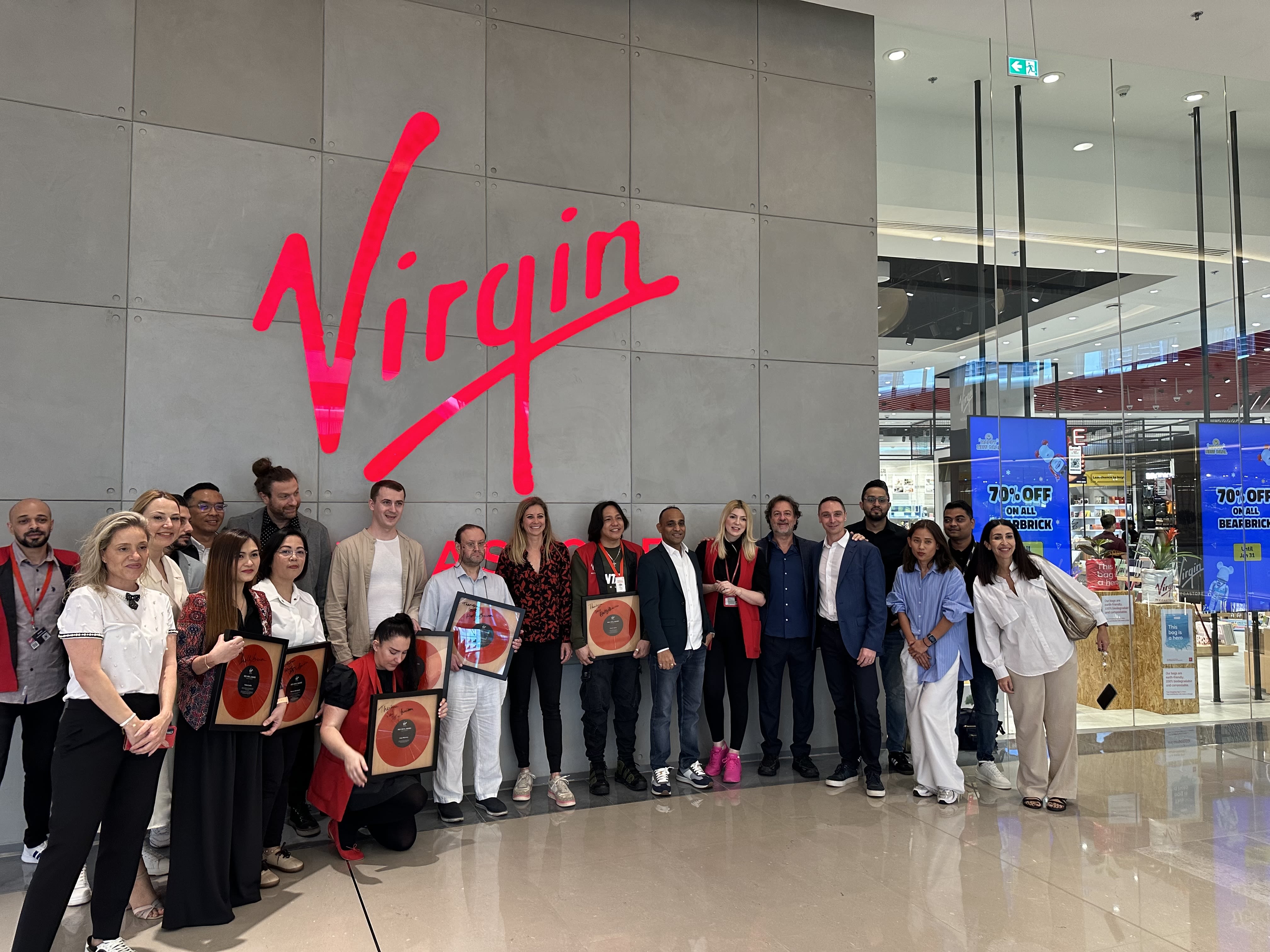 Holly Branson with the team at Virgin Megastore Dubai
